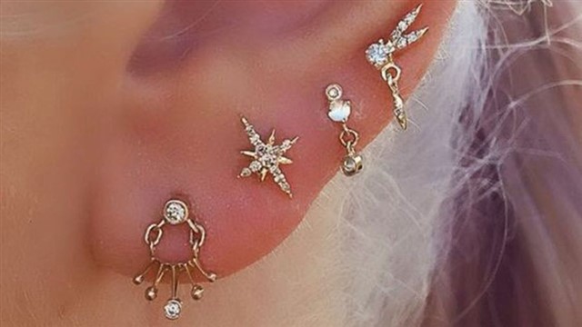 Another way to embrace this trend is aligning individual piercings so they look like your zodiac sign's constellation - seriously how cute would that ...